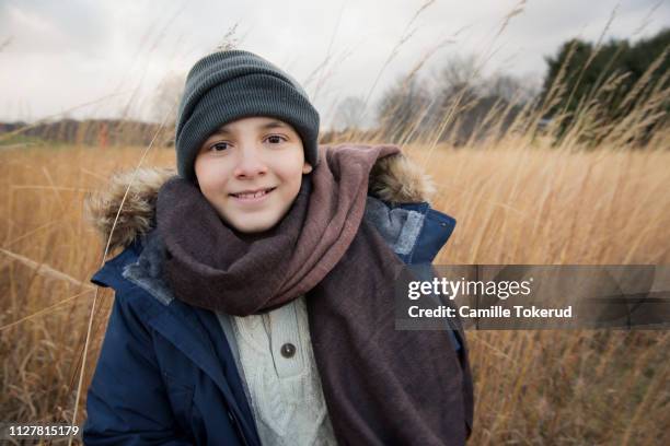 a 11 year old boy outside - kid in winter coat stock pictures, royalty-free photos & images