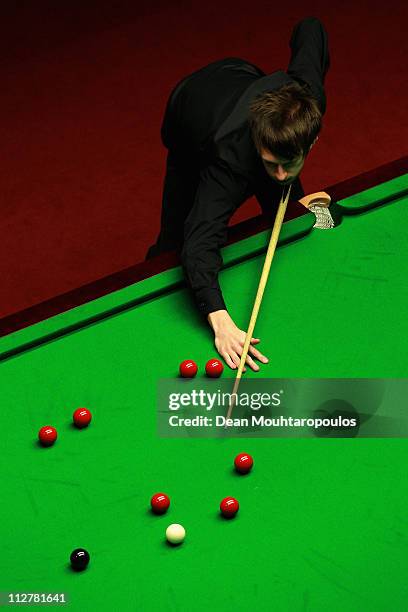 Judd Trump of England plays a shot in the round two game against Martin Gould of England on day six of the Betfred.com World Snooker Championship at...