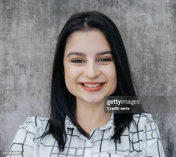 portrait of cheerful young woman looking at camera - girl mugshots stock pictures, royalty-free photos & images