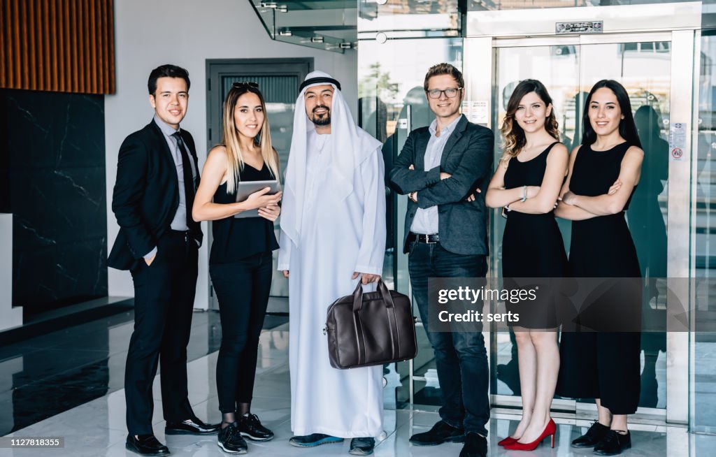 Portrait of business team with an Arab Businessman