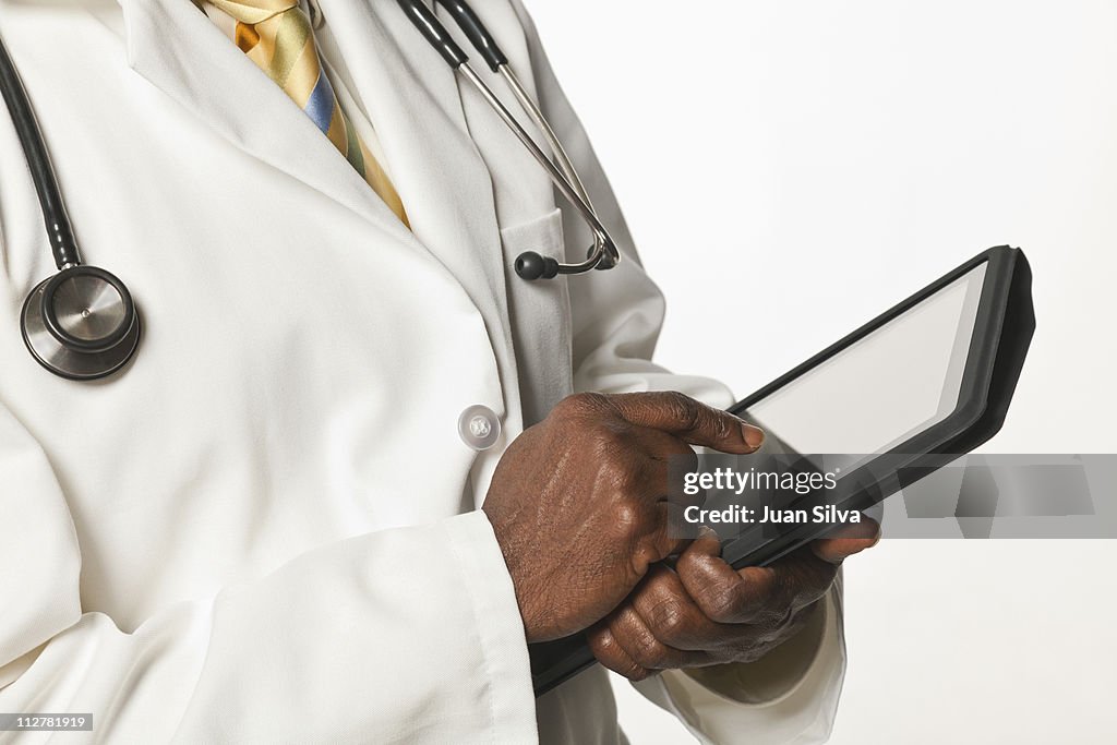 Doctor holding digital tablet.