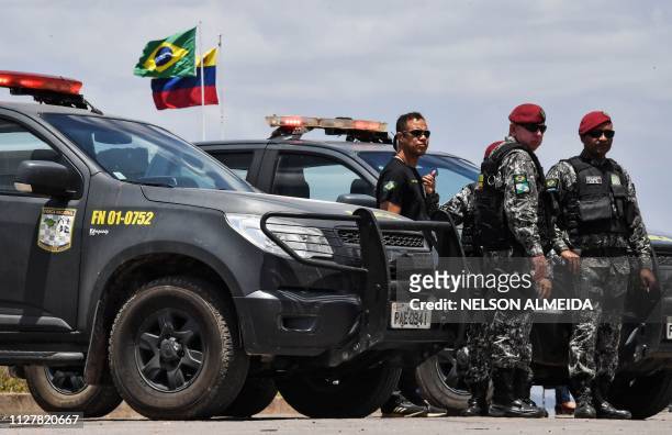 Brazilian soldiers stand guard at the Brazil-Venezuela border, in Pacaraima, Roraima state, Brazil, on February 27, 2019. - Venezuela's opposition...