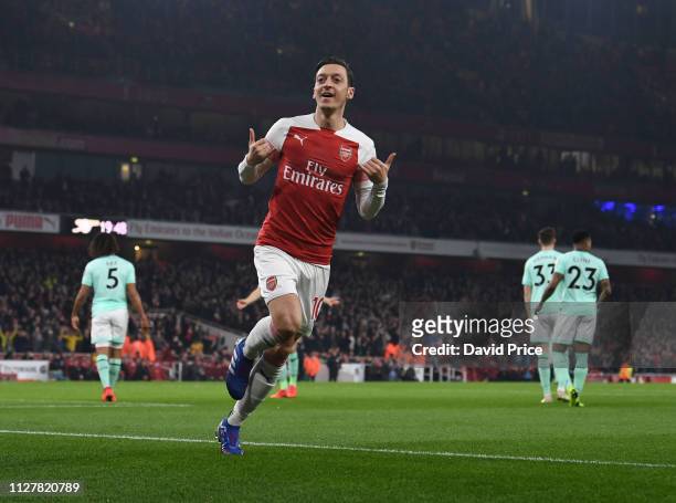 Mesut Ozil celebrates scoring a goal for Arsenal during the Premier League match between Arsenal FC and AFC Bournemouth at Emirates Stadium on...