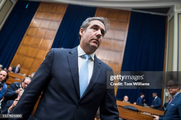 Michael Cohen, former attorney for President Donald Trump, arrives back from a break in testimony during a House Oversight and Reform Committee...