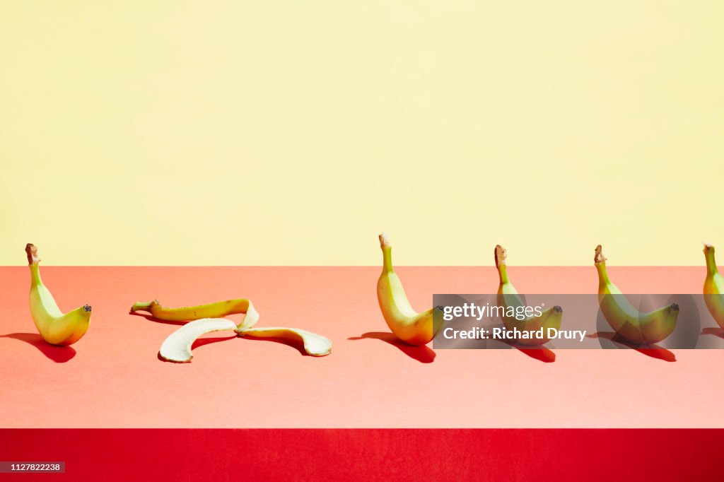A banana skin in a row of bananas