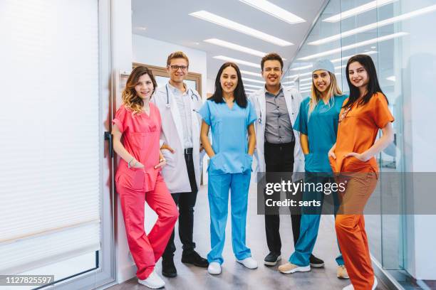 portrait of young medical professionals at hospital - nurse uniform stock pictures, royalty-free photos & images