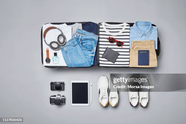 traveler's accessories and clothes - flatlay fashion stockfoto's en -beelden