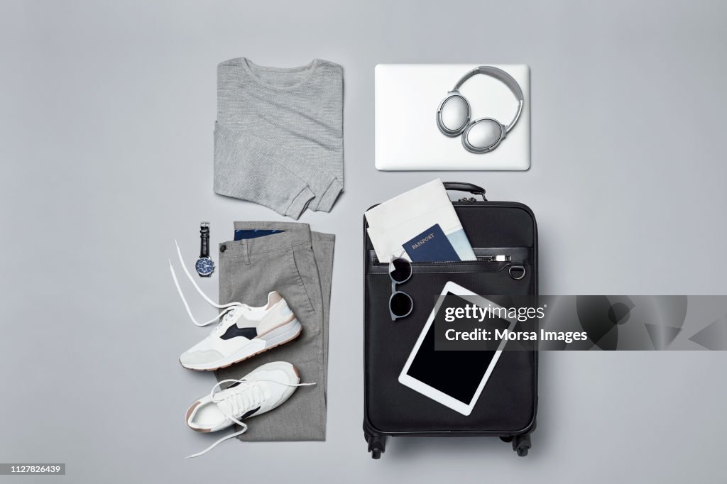 Menswear with suitcase and personal accessories