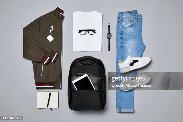 flat lay of traveler's clothes and accessories - fashion collection stock-fotos und bilder