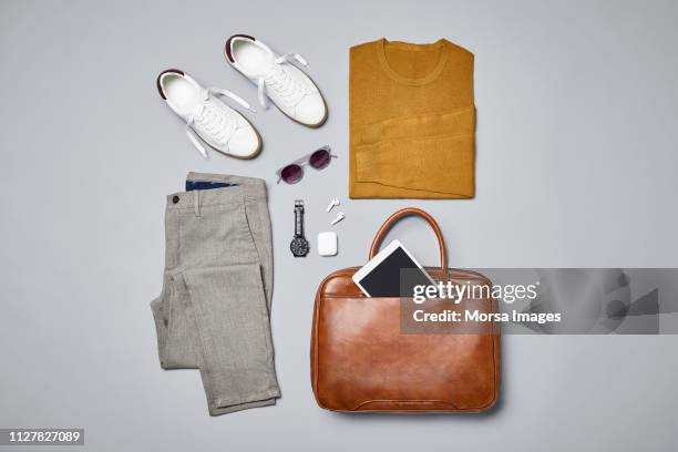 smart casual with technologies and accessories - sunglasses overhead fotografías e imágenes de stock