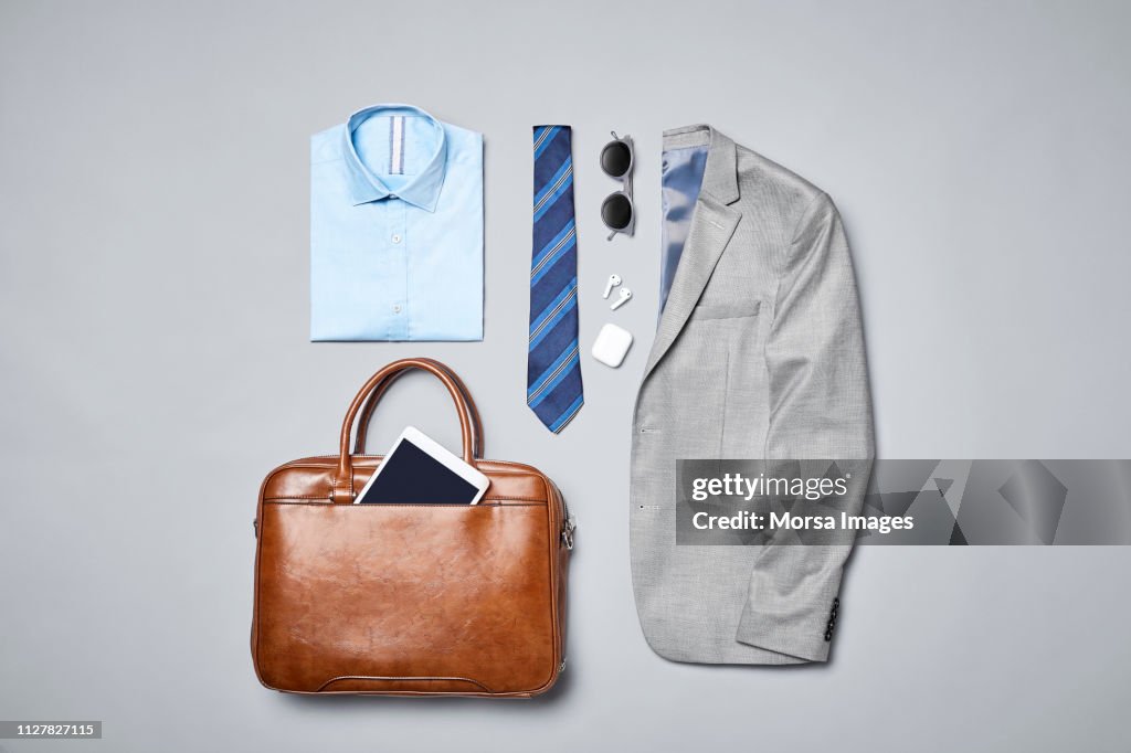 Formalwear arranged on gray background