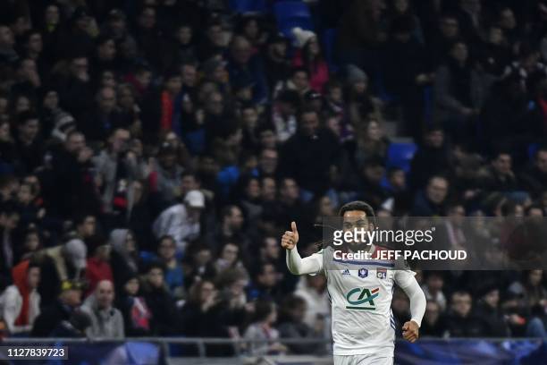 Lyon's Belgian defender Jason Denayer celebrates after scoring during the French Cup quarter-final football match between Olympique Lyonnais and...