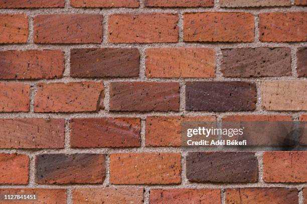 part of a brick wall - pared de ladrillos fotografías e imágenes de stock