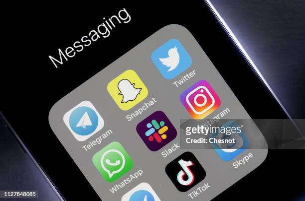 N this photo illustration, the logos of the messaging applications Telegram, Snapchat, Twitter, WhatsApp, Slack, Instagram, Messenger, TikTok and...