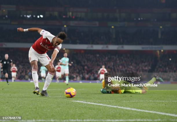Pierre-Emerick Aubameyang of Arsenal takes the ball around Bournemouth goalkeeper Artur Boruc to score the fourth goal for his team during the...