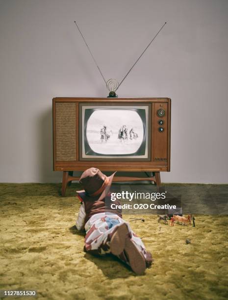 vintage tv and little boy cowboy - retro television stock pictures, royalty-free photos & images