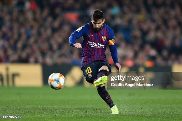 Lionel Messi of FC Barcelona takes a free-kick during the Copa del Semi Final first leg match between Barcelona and Real Madrid at Nou Camp on...