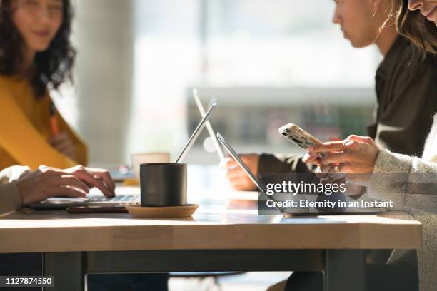 close up young people working on laptops in a modern space - call conference stock-fotos und bilder