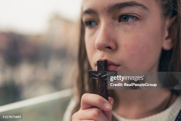 religious girl - rosary beads stock pictures, royalty-free photos & images