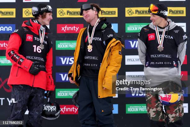 Birk Ruud of Norway in second place, James Woods in first place and Nicholas Goepper of the United States in third place celebrate on the podium for...