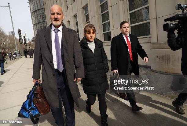 Actress Allison Mack leaves the Brooklyn Federal Courthouse with her lawyers after a court appearance surrounding the alleged sex cult NXIVM on...