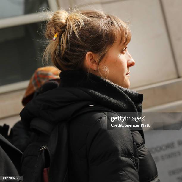 Actress Allison Mack leaves the Brooklyn Federal Courthouse with her lawyers after a court appearance surrounding the alleged sex cult NXIVM on...