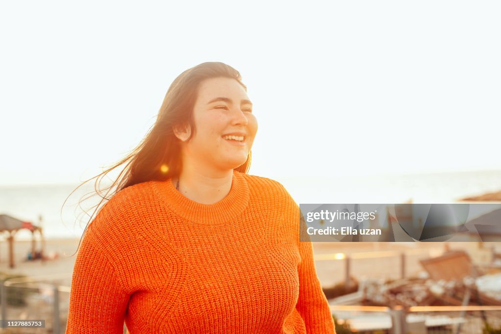 Cheerful girl walking outdoors