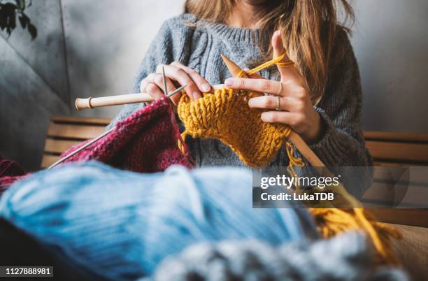 close up on woman's hands knitting - button craft stock pictures, royalty-free photos & images