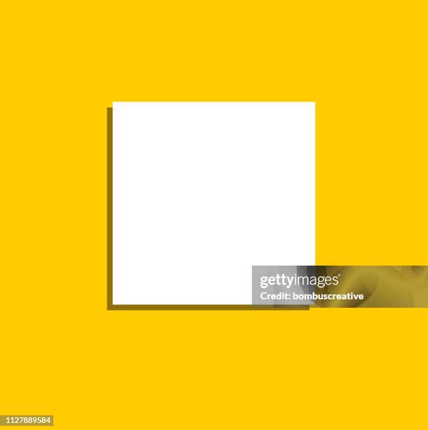 white paper isolated with soft shadow on yellow background - square frame on table stock illustrations
