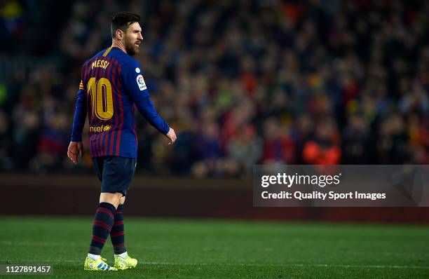 Lionel Messi of Barcelona looks on during the Copa del Rey Semi Final first leg match between FC Barcelona and Real Madrid at Nou Camp on February...