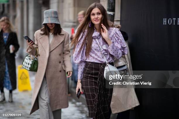 Filippa Haegg wearing plaid skirt and blouse with dots print and Felicia Akerstrom Ma wearing bucket hat, beige wool coat and Mulberry bag is seen...