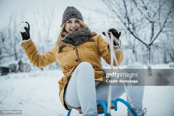 porträt einer jungen frau, die schnee und schönen wintertag genießen - european best pictures of the day december 29 2017 stock-fotos und bilder