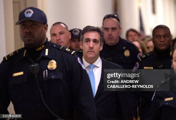 Michael Cohen , US President Donald Trump's former personal attorney, leaves after testifying before the House Oversight and Reform Committee in the...
