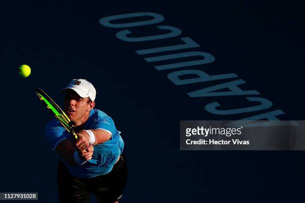 Sam Querrey of United States returns a ball during the match against John Isner of United States as part of the day 3 of the Telcel Mexican Open 2019...