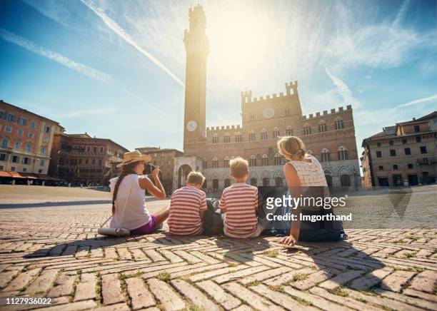 family sightseeing siena, italy - siena italy stock pictures, royalty-free photos & images