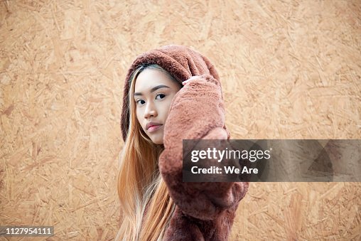 Young woman in hooded fur jacket. Young woman in hooded fur jacket.