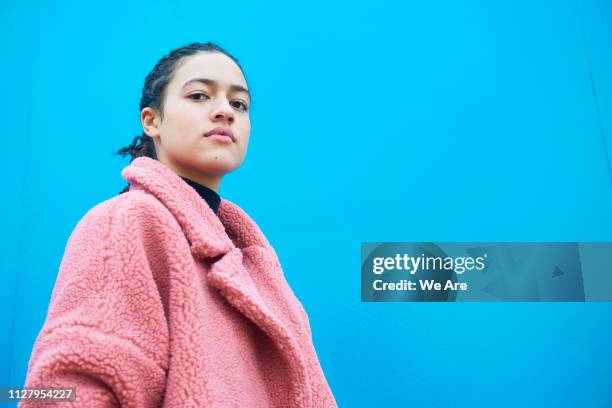 heroic portrait of young woman in fur coat. - hero and not superhero fotografías e imágenes de stock