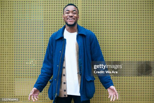 Young man laughing casually.