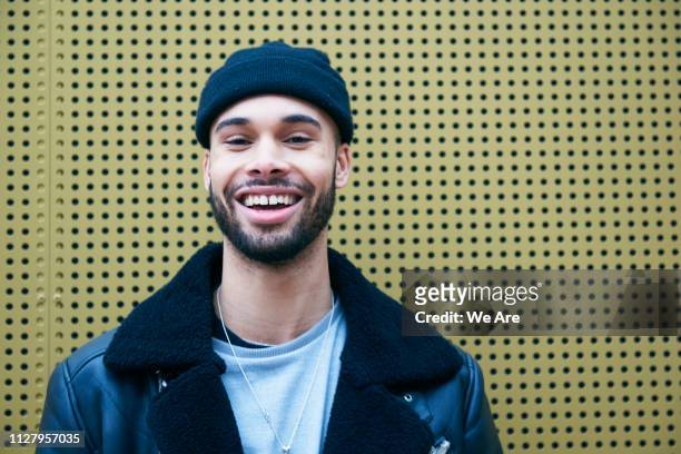 portrait of young fashionable man smiling. - entrepreneur stockfoto's en -beelden