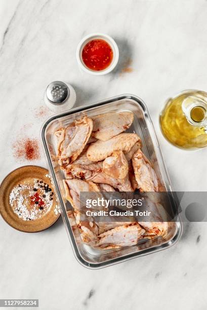 marinated raw chicken wings - marinated stock pictures, royalty-free photos & images