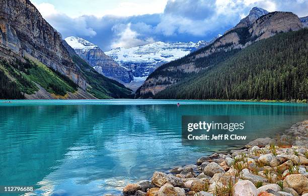 storm clouds over lake louise - lake louise stockfoto's en -beelden