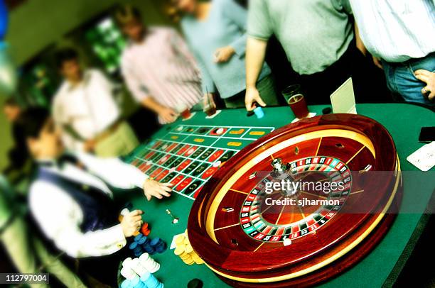 roulette table in cross process - roulette dealer stock pictures, royalty-free photos & images