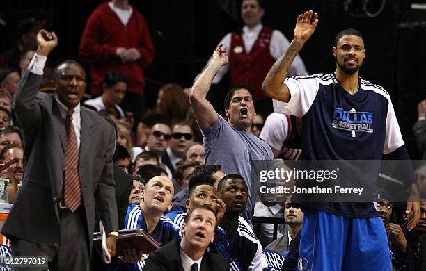 Dallas Mavericks owner, Mark Cuban , Tyson Chandler and assistant coach Dwayne Casey call for a shooting foul against the Portland Trail Blazersin...