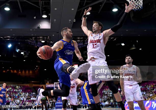 Adam Gibson of the Bullets passes the ball during the round 17 NBL match between the Brisbane Bullets and the Illawarra Hawks at Brisbane Convention...