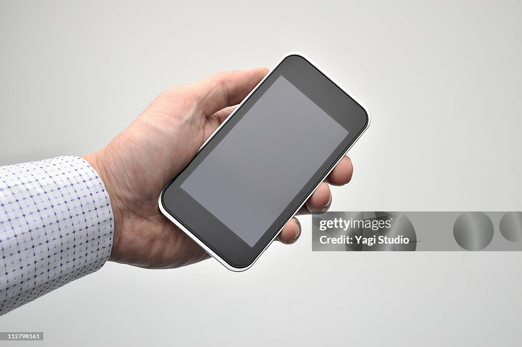 Smartphone which it has in the hand