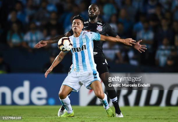 Jonatan Cristaldo of Racing Club fights for the ball with Carlos Augusto of Corinthians during a match between Racing Club and Corinthians as part of...