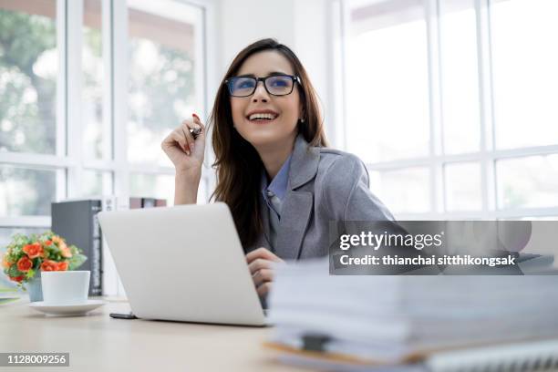 smiling in office even a lot of jobs - officer military rank fotografías e imágenes de stock