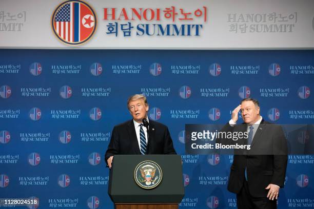 President Donald Trump, left, speaks as Mike Pompeo, U.S. Secretary of state, looks on during a news conference following the DPRK-USA Hanoi Summit...