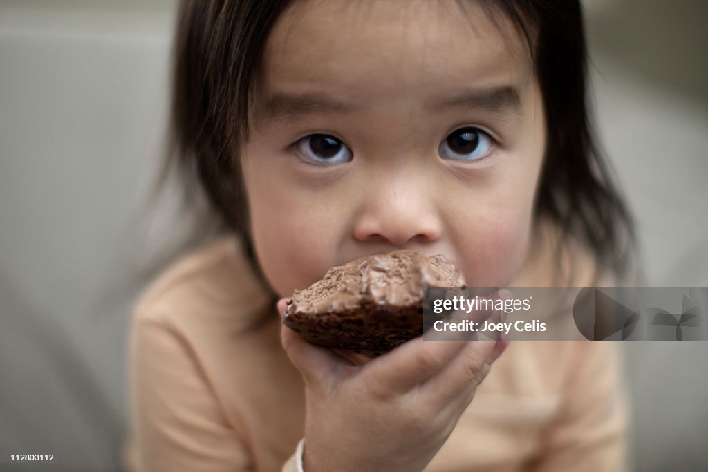 Girl eating ice cream sandwich