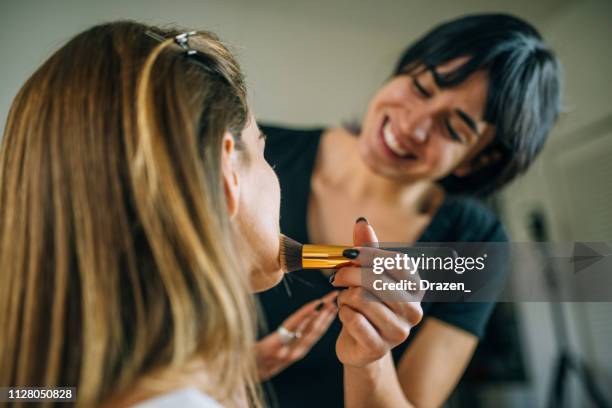 millennial generation latina starting her make up school - makeup artist stock pictures, royalty-free photos & images